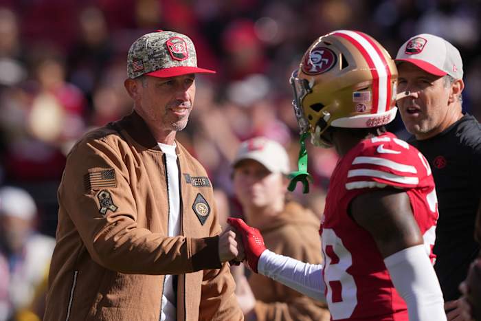 Darrell Luter Jr. daps up Kyle Shanahan